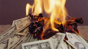 burning-wasting-money